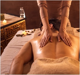 Relaxing massage with candles at Veloura Luxury Spa